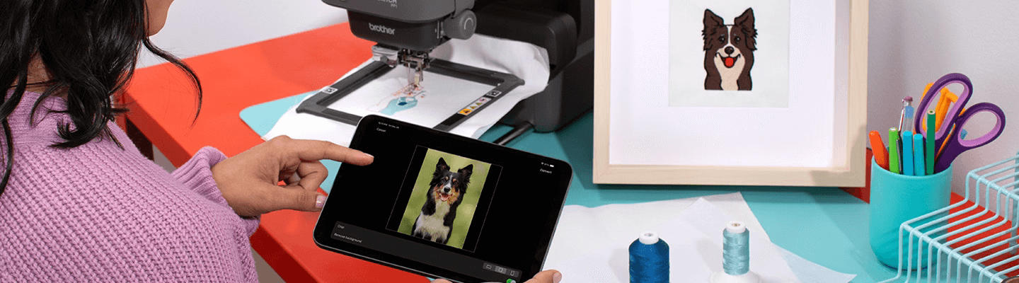 Artspira, Import your own designs and transfer wirelessly, photo showing phone connecting to sewing machine